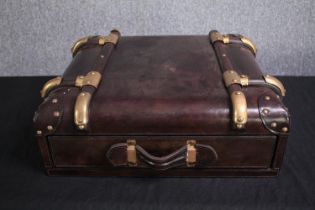 A vintage style faux leather table top single drawer cabinet in the form of a suitcase. H.19 W.50
