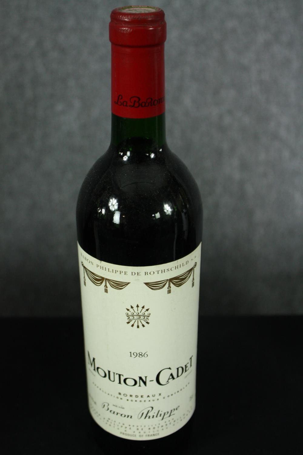 Eleven bottles of Mouton-Cadet Bordeaux. Ten are 1982 and one is 1986. H.30cm. (Each) - Image 5 of 5