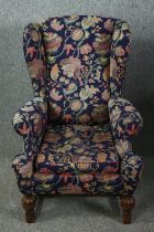 Wing armchair, mid century Jacobean style oak. H.113cm.