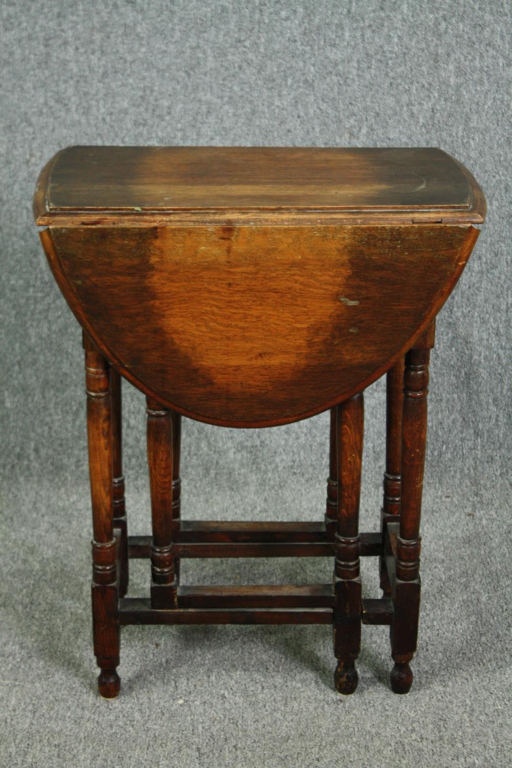 Occasional table, mid century oak with drop flap gateleg action. H.73 W.89 D.58cm.