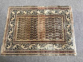 Rug, Kazak with repeating boteh motifs within multiple borders. L.140 W.105cm.