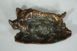 A bronze figure of a wild boar. L.16 W.10cm.