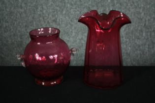 Two cranberry glass vases. H.16cm. (Largest)