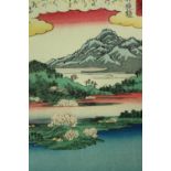 Woodblock print, Japanese, mountains and lakes, signed. H.26 W.19cm.