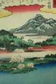 Woodblock print, Japanese, mountains and lakes, signed. H.26 W.19cm.
