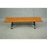 Coffee table, 1960s teak with ebonised splay supports on pad feet. H.29 W.48 D.28cm.