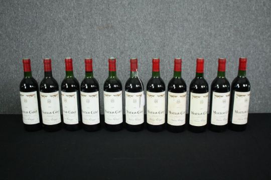 Eleven bottles of Mouton-Cadet Bordeaux. Ten are 1982 and one is 1986. H.30cm. (Each) - Image 1 of 5