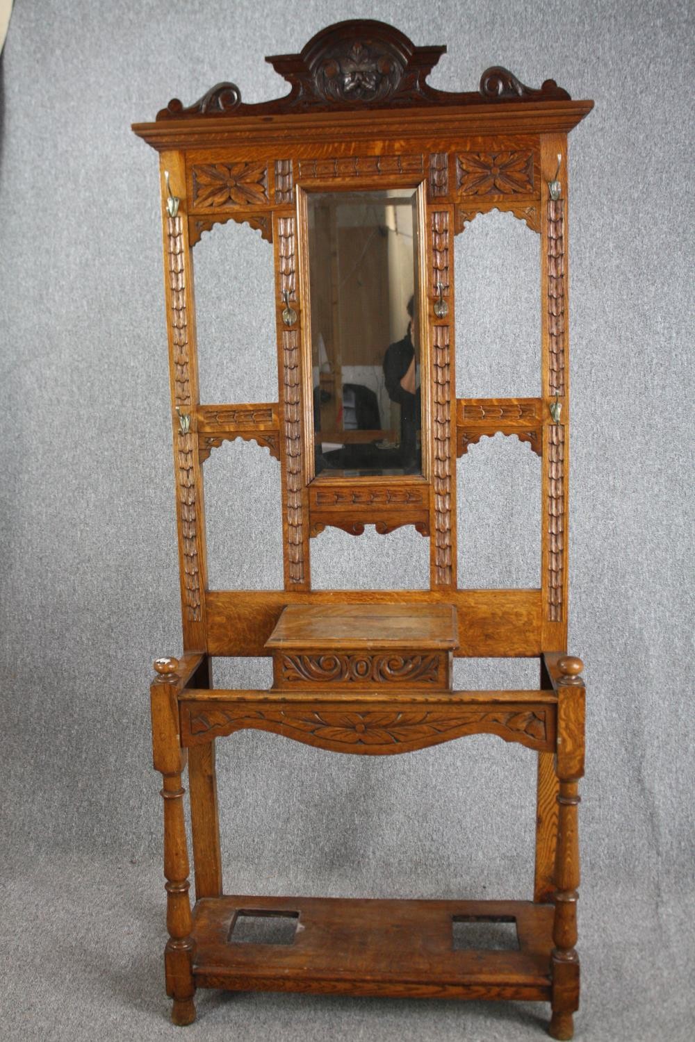 A Victorian period oak hall hat /coat and cane stand, dating from around 1890. With a shaped cornice - Image 2 of 6