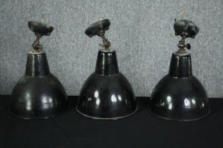 A set of three mid century industrial ceiling light shades in black enamel holophane. H.33 Dia.25cm.