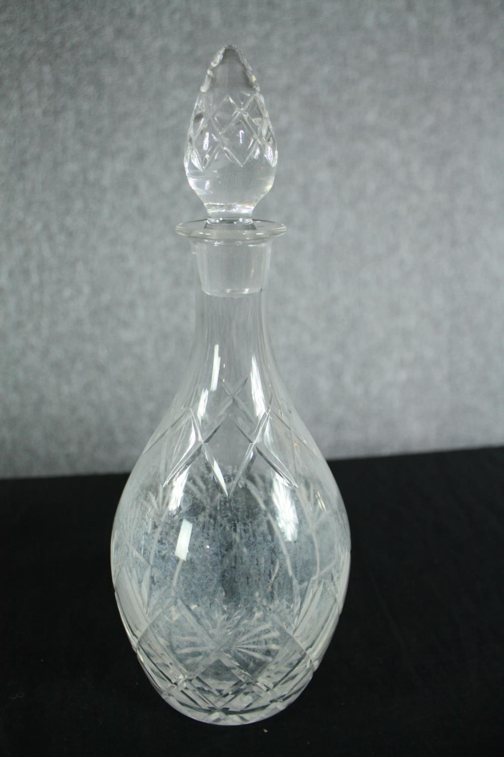 A collection of four early twentieth century cut glass decanters complete with their stoppers. One - Image 4 of 4