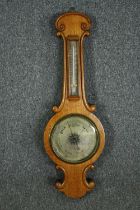Barometer, 19th century oak, banjo shaped with silvered dial and thermometer. H.83cm.