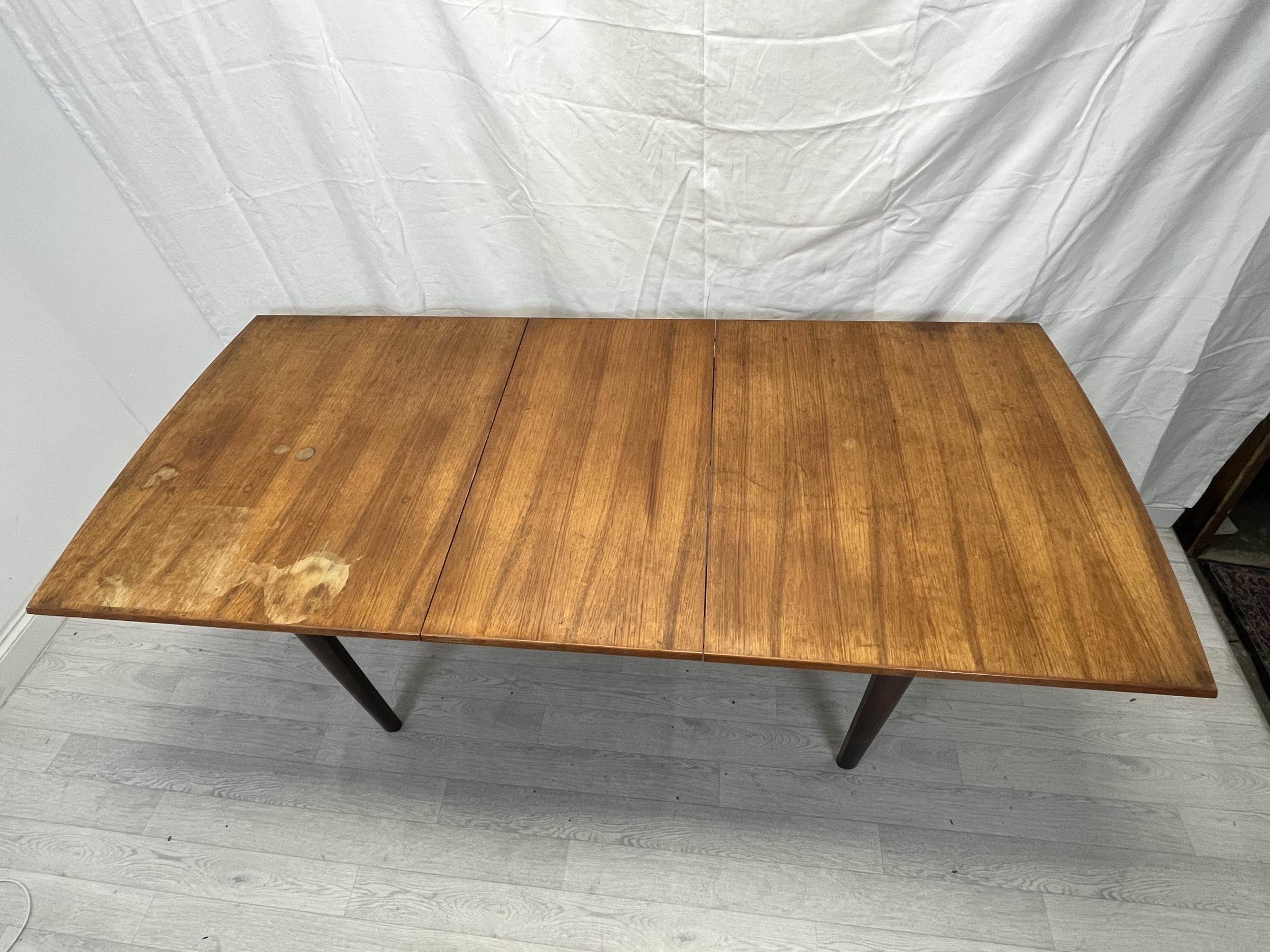Dining table, possibly Gordon Rusell, mid century teak fitted with integral extension leaf. H.76 W. - Image 7 of 8
