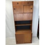 A mid century teak stacking cabinet in five sections. H.196 W.88 D.40cm.