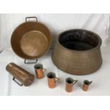 A collection of copper items; cooking vessels and measuring jugs. Largest H.20 W.45cm
