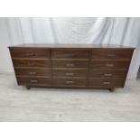 Sideboard, contemporary teak with a bank of twelve drawers. H.77 W.183 D.32cm.