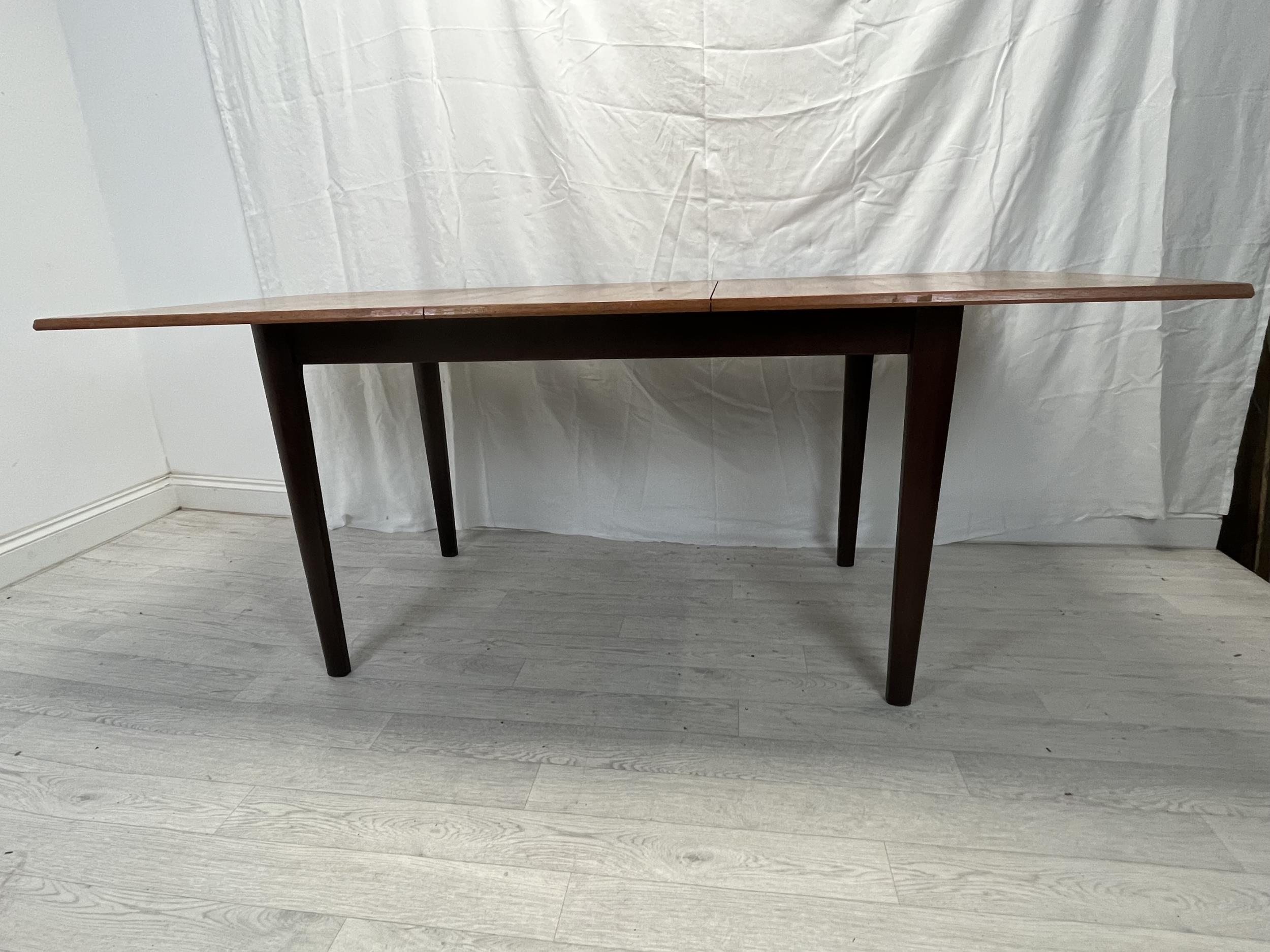 Dining table, possibly Gordon Rusell, mid century teak fitted with integral extension leaf. H.76 W. - Image 4 of 8