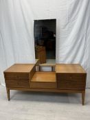 A mid century teak dressing table fitted with swing mirror. H.147 W.137 D.51cm.