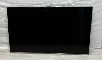 A 46" Samsung TV with remote control.