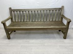 A vintage weathered teak garden bench. H.90 W.179 D.62cm.