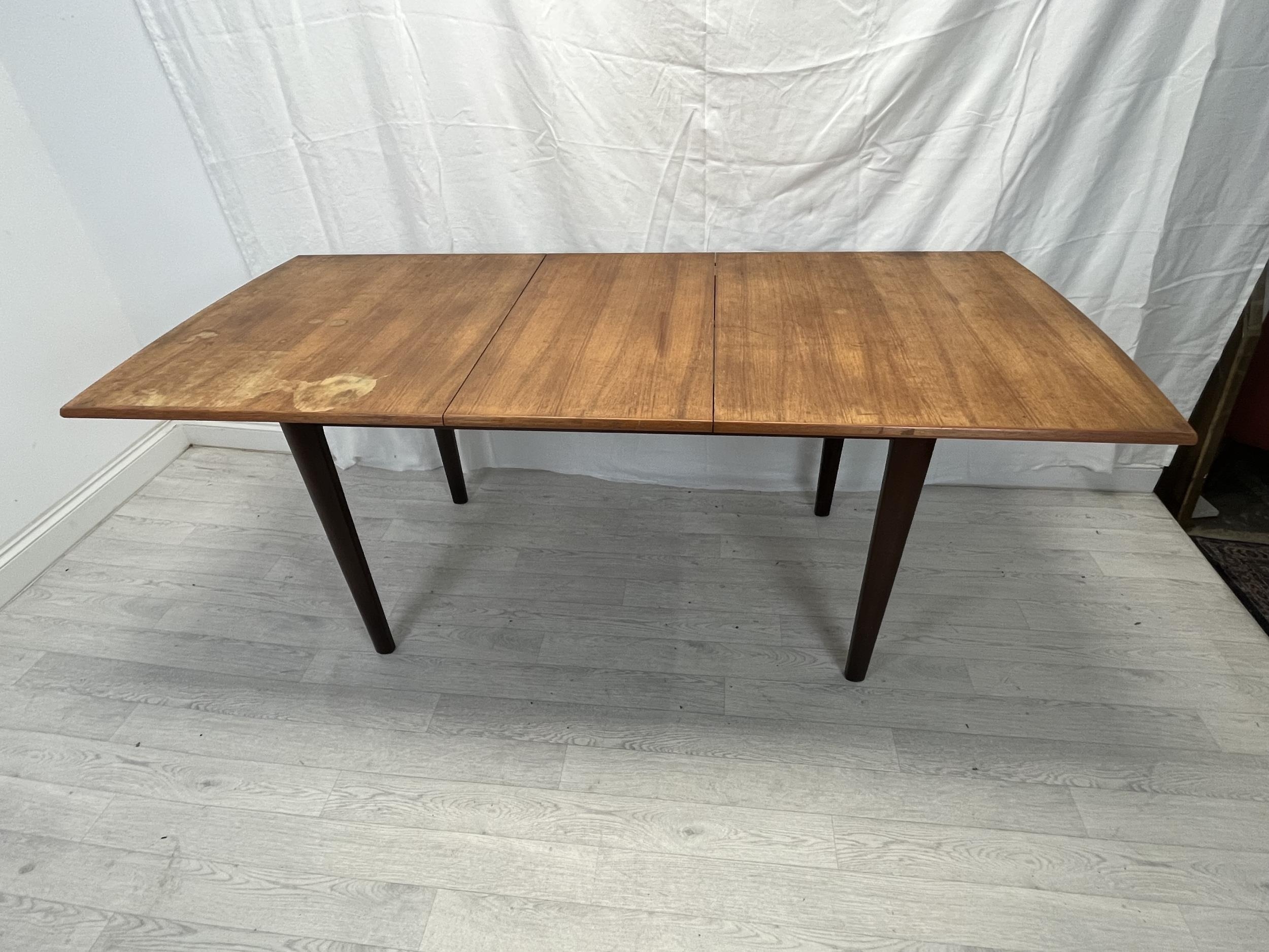 Dining table, possibly Gordon Rusell, mid century teak fitted with integral extension leaf. H.76 W. - Image 5 of 8