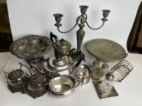 A mixed collection of silver plate to include candelabra, coffee set etc. H.35 W.34cm.
