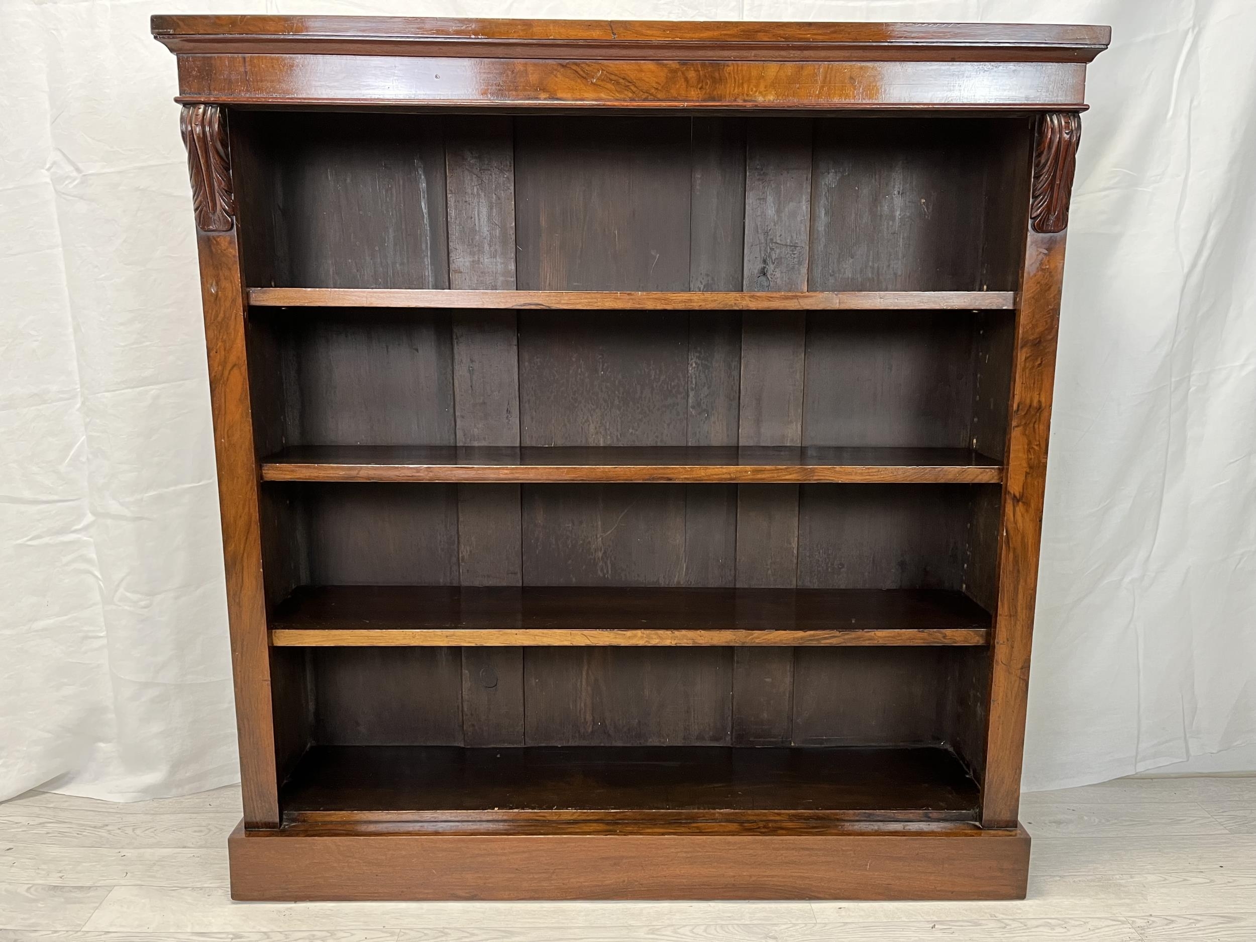 Dwarf open bookcase, mid 19th century figured walnut. H.117 W.114.5 D.27cm.