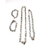 A 1960s burnished silver brutalist long industrial chain metamorphic necklace along with an openwork