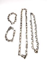 A 1960s burnished silver brutalist long industrial chain metamorphic necklace along with an openwork