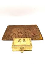 A 19th Century Indian brass lockable spice box and craved hardwood elephant design panel. L.16 D.