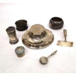 A collection of silver items, including a weighted silver inkwell (damaged), a silver shell napkin