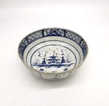 A 18th century Delft blue and white Chinese design bowl with pagoda and tree design. (chipped and