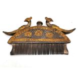 A 19th century Indian white metal and gilt moustache and beard comb of crescent form with a cast
