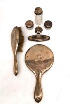 An Edwardian silver dressing table set by William Atkinson, consisting of a hand mirror, a hair