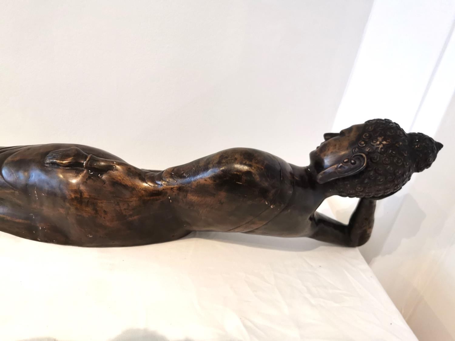 An early 20th century large brass reclining buddha. L.100 H.26 D.20cm. - Image 8 of 8