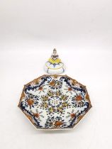 A 19th century faience hand painted ceramic fruit colander along with a Sitzendorf Art Deco exotic