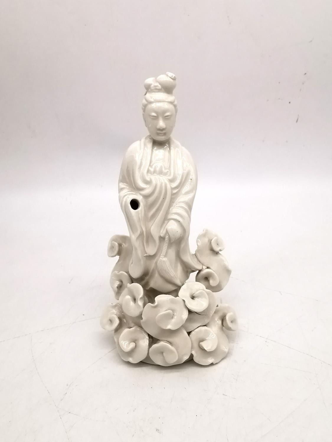 A Chinese 19th century blanc de chine figure of Guanyin surrounded by stylised clouds. H.21 W.11cm. - Image 2 of 7