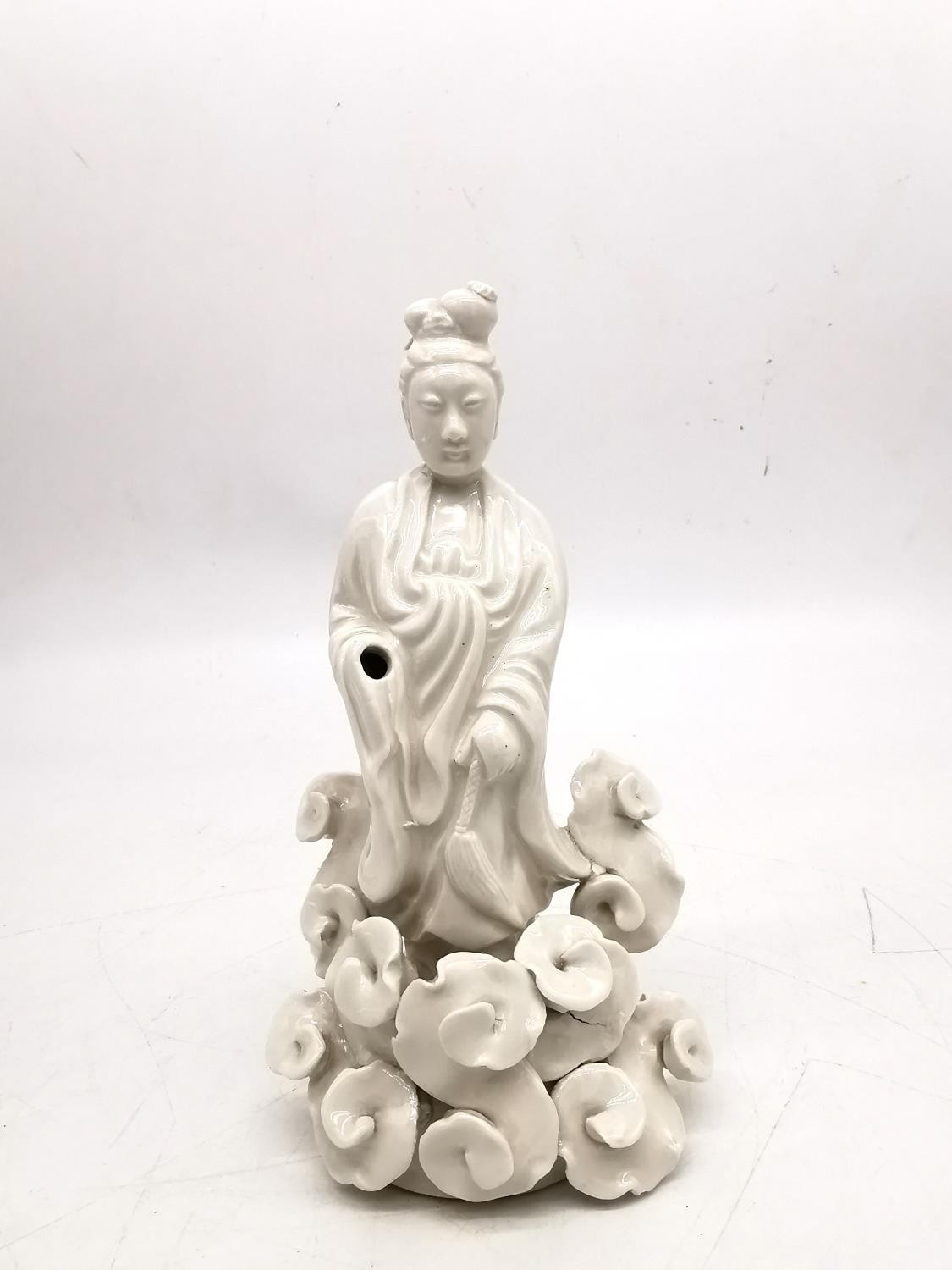 A Chinese 19th century blanc de chine figure of Guanyin surrounded by stylised clouds. H.21 W.11cm. - Image 6 of 7