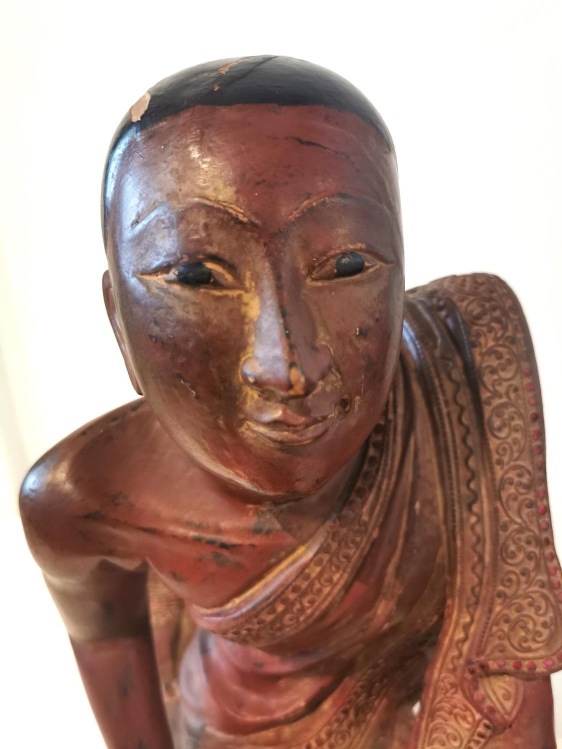 A 19th/early 20th century carved and lacquered Burmese kneeling figure of a monk wearing a robe. The - Image 2 of 10