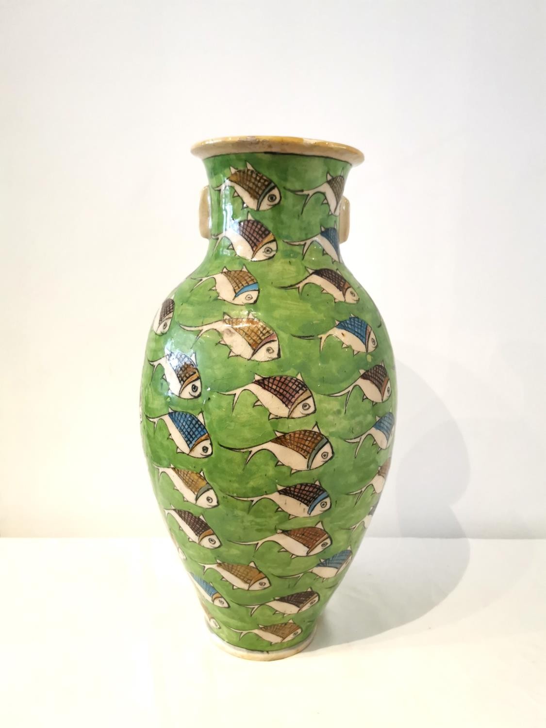 A large twin handled Persian Iznik ceramic vase with green ground and painted fish. H.54 D.25cm. - Image 3 of 12