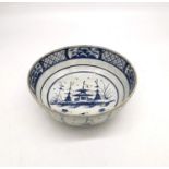 A 18th century Delft blue and white Chinese design bowl with pagoda and tree design. (chipped and