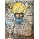 A large Mid-century silver Greek Orthodox icon on board of Saint Frances. Hand painted faces and