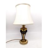 A 19th century gilt metal rams head classical urn table lamp on white marble base. H.47cm diameter
