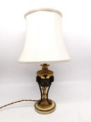 A 19th century gilt metal rams head classical urn table lamp on white marble base. H.47cm diameter