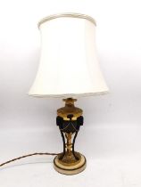 A 19th century gilt metal rams head classical urn table lamp on white marble base. H.47cm diameter