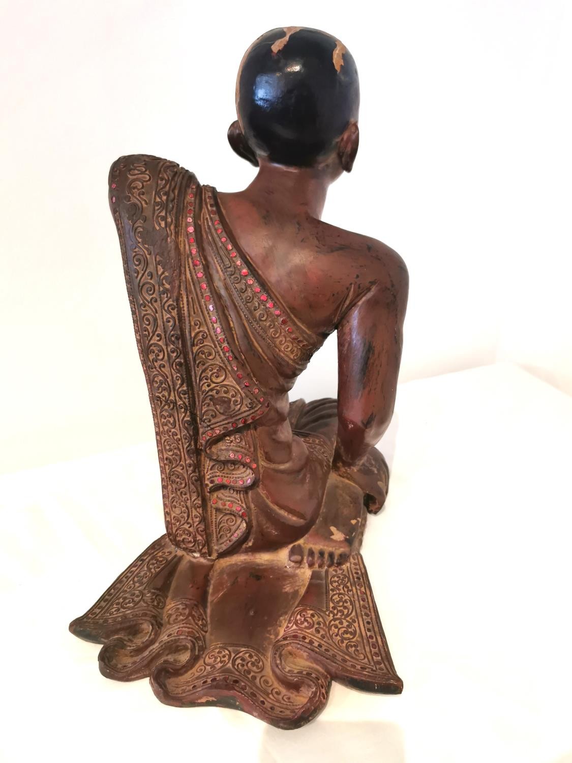 A 19th/early 20th century carved and lacquered Burmese kneeling figure of a monk wearing a robe. The - Image 5 of 10