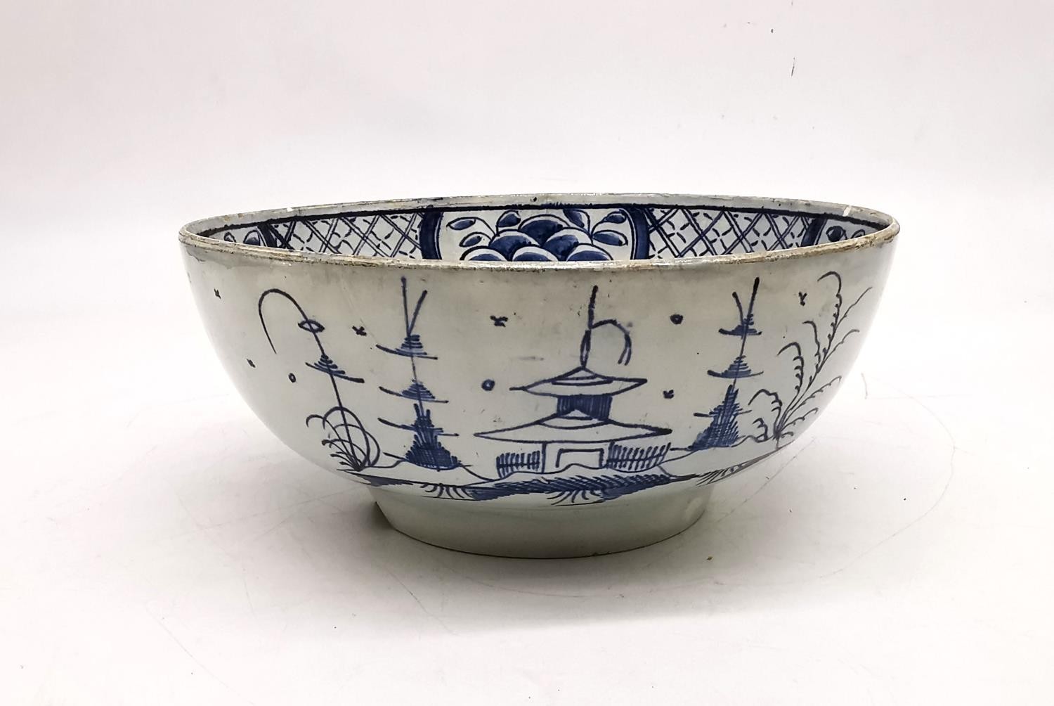 A 18th century Delft blue and white Chinese design bowl with pagoda and tree design. (chipped and - Image 3 of 12