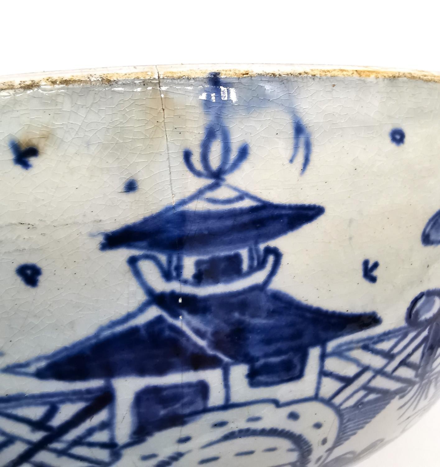 A 18th century Delft blue and white Chinese design bowl with pagoda and tree design. (chipped and - Image 8 of 12