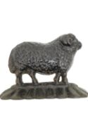 A ate 19th/early 20th century cast iron sheep with curled horns doorstop. H.17 L.23cm.