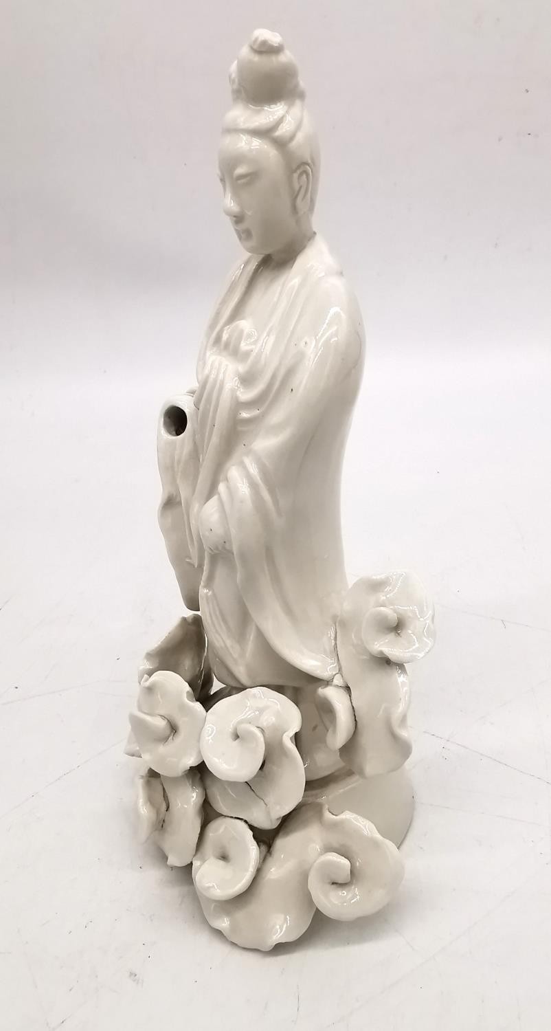A Chinese 19th century blanc de chine figure of Guanyin surrounded by stylised clouds. H.21 W.11cm. - Image 3 of 7