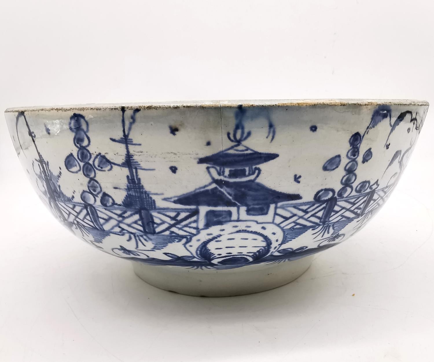 A 18th century Delft blue and white Chinese design bowl with pagoda and tree design. (chipped and - Image 7 of 12